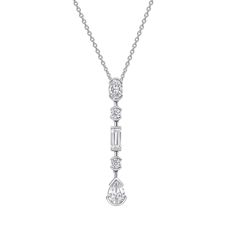 An elongated gemstone held in a partial metal bezel setting on a delicate chain necklace